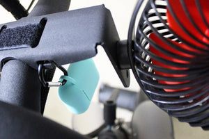 
                  
                    aqua airpod case cover attached to fan kit by caribiner
                  
                