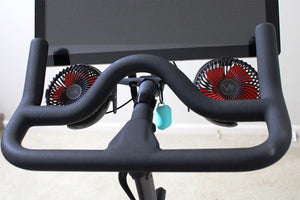 
                  
                    aqua airpod case cover hanging from fan kit on Peloton
                  
                