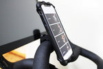 Smart phone mounted to handlebar via phone holder in vertical position